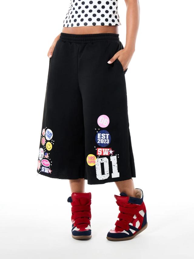 black wide leg culottes with colorful graphic patches