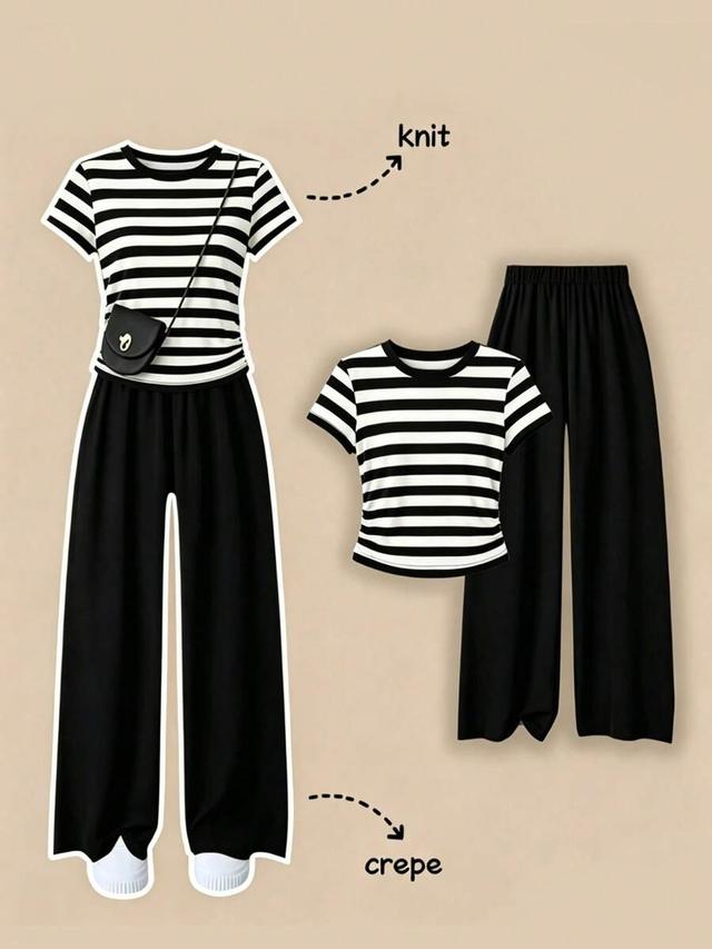 striped round neck short sleeve top and black trousers