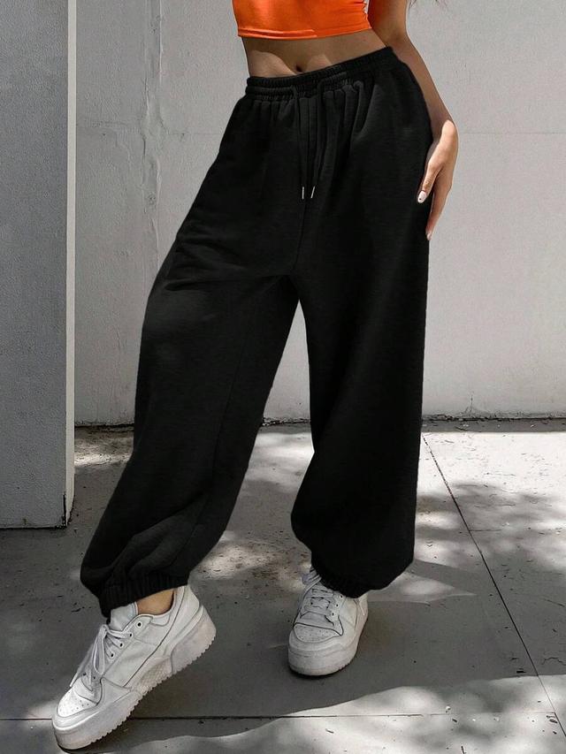 loose drawstring waist ankle-tied black sweatpants