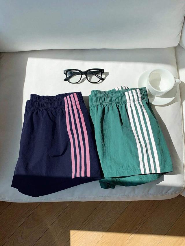 green white sporty mini shorts with pink side stripes