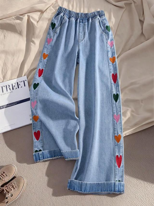 light wash denim jeans with heart embroidery