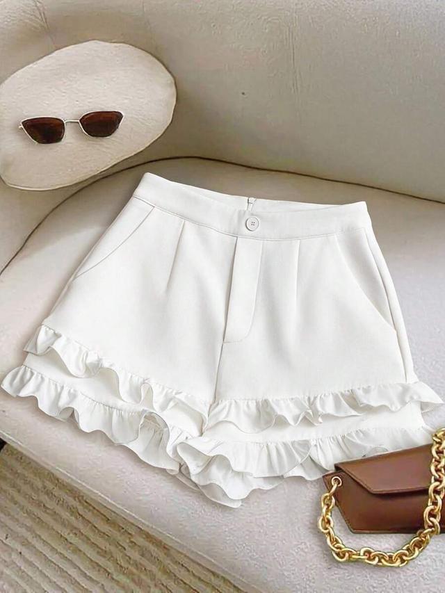 white ruffled flare shorts with cinched waist