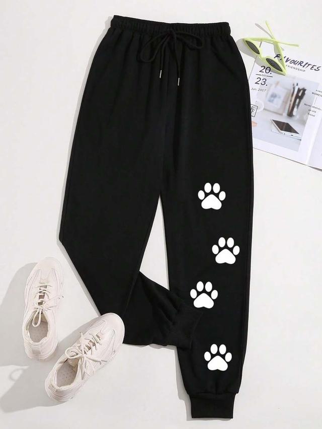 black drawstring sweatpants with white bear footprint print
