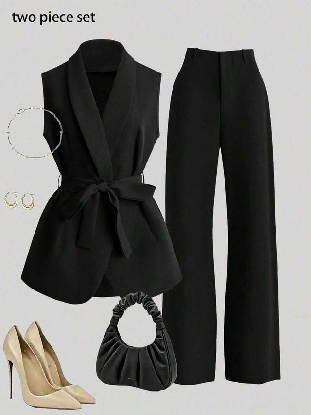 black sleeveless belted vest jacket