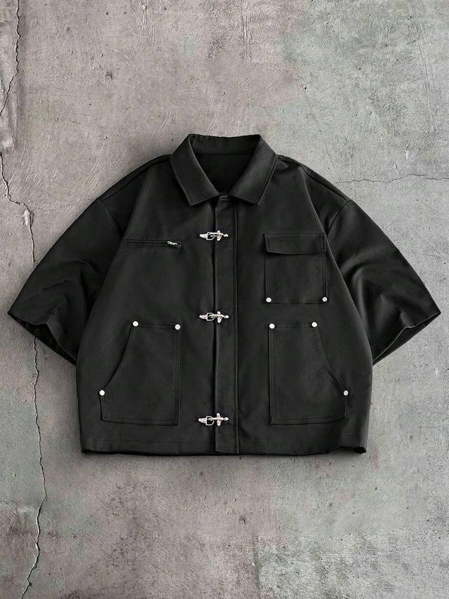 minimalist black short sleeve shirt with buckle closures