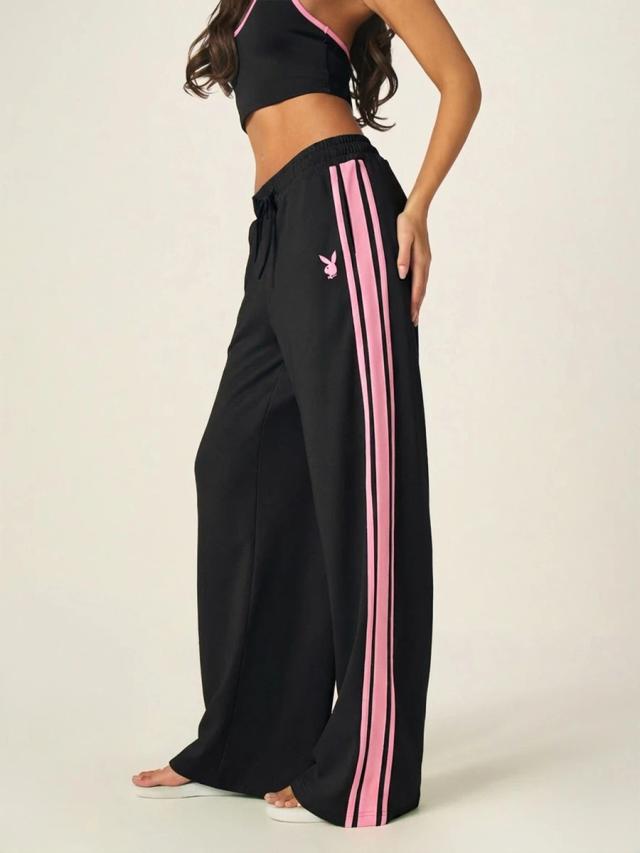 black wide leg track pants with pink side stripes