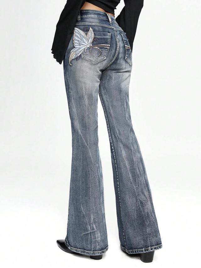 butterfly embroidered distressed flared low waist jeans