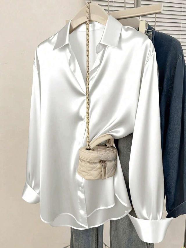 dark blue women's white satin button-down collared shirt