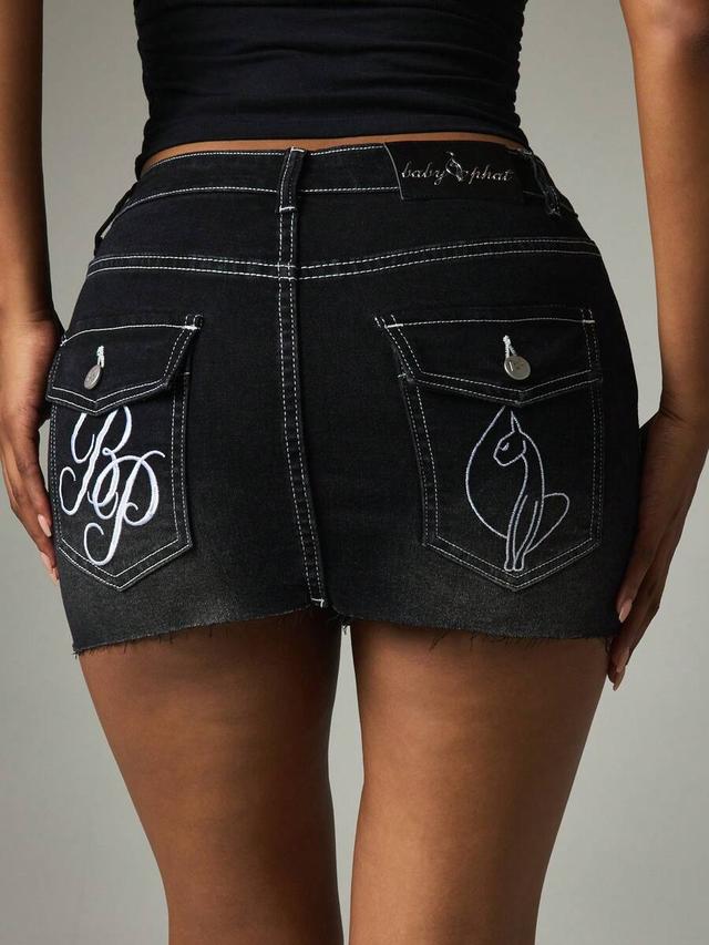 black denim mini skirt with white contrast stitching