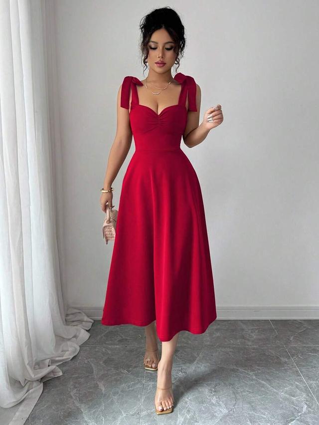 red sleeveless spaghetti strap tie cinched waist a-line dress