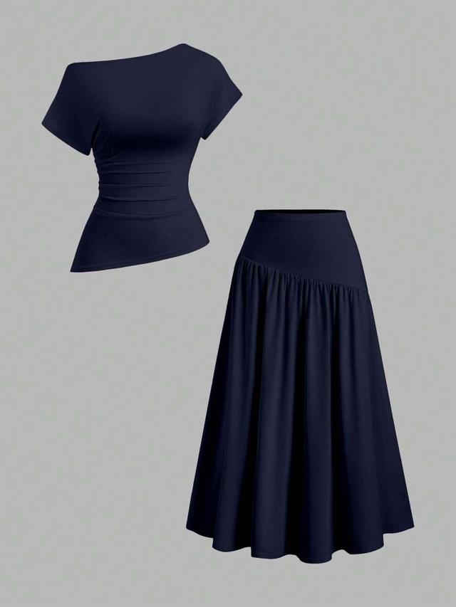 navy asymmetrical pleated skirt and top set