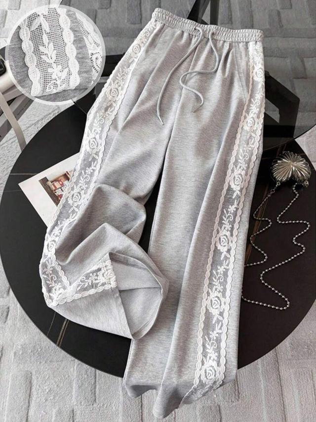 grey loose fit straight-leg pants with lace trim