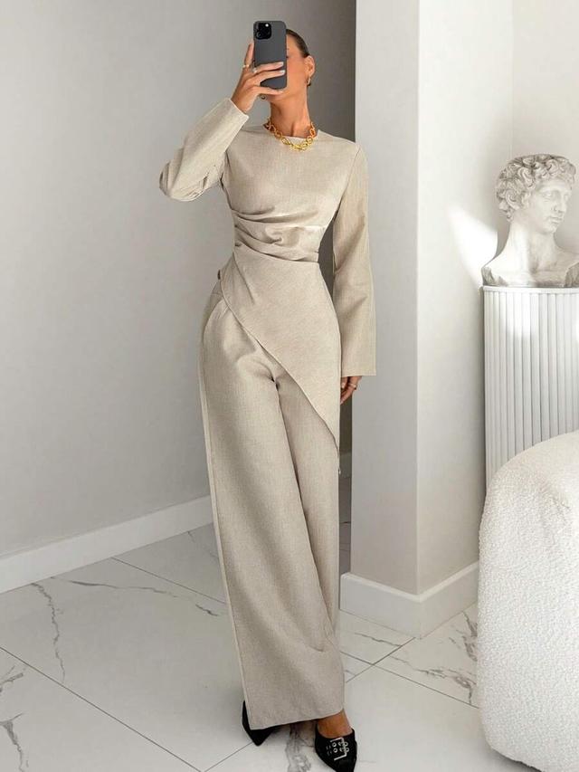 beige asymmetrical pleated top and wide-leg trousers set