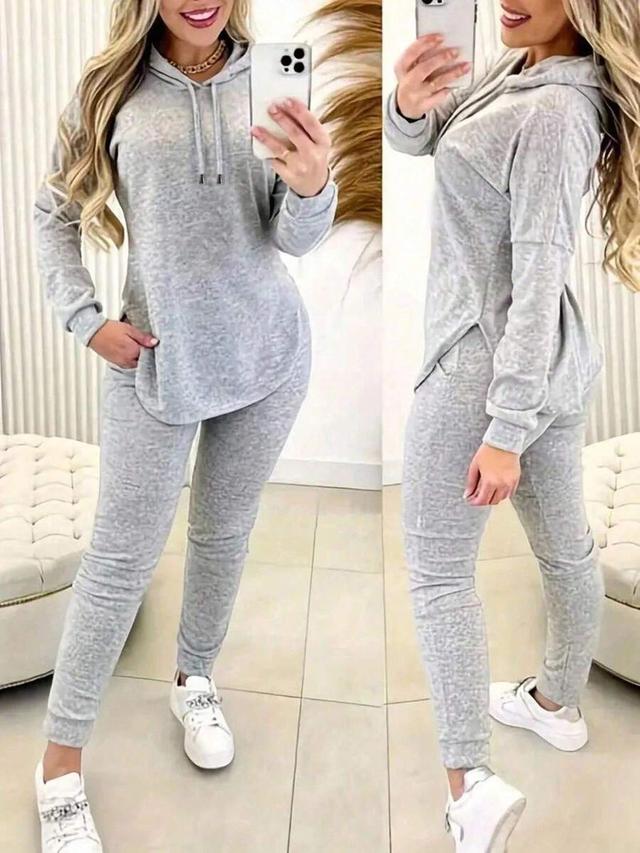 grey hooded sweatshirt and matching high waist jogger pants