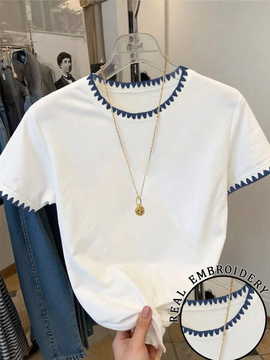 white cotton t-shirt with blue contrast embroidery trim