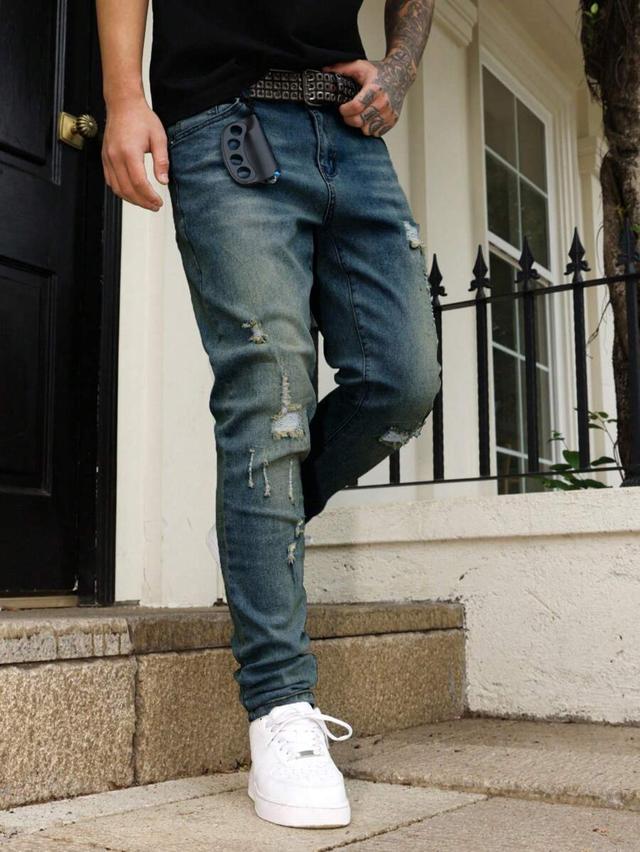 distressed washed blue slim fit denim jeans