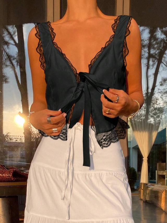black satin camisole with lace trim and bow