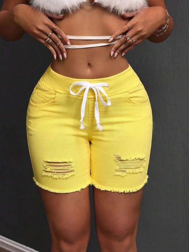 yellow distressed denim drawstring shorts