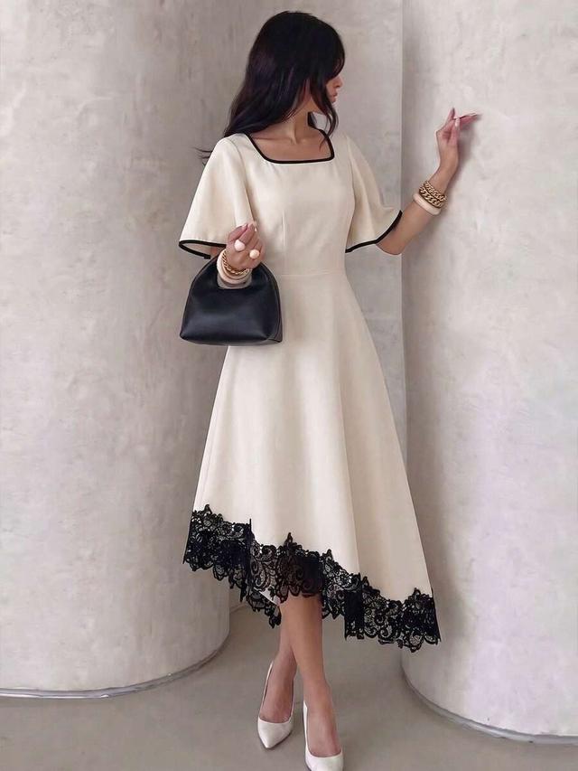 cream midi dress with black contrast trim and lace