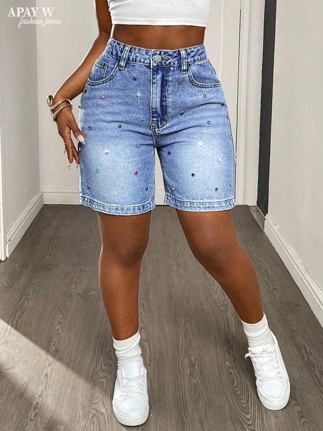 high-waisted light wash denim shorts with colorful rhinestones