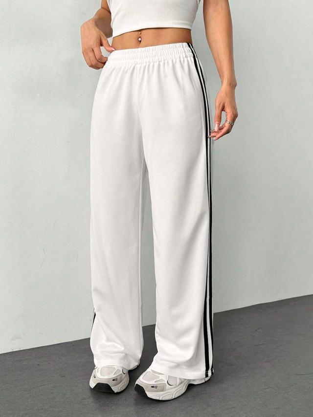 white knitted straight leg sweatpants with side stripe