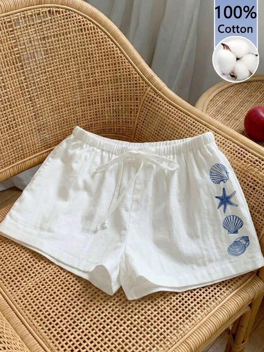 white cotton casual shorts with sea shell print
