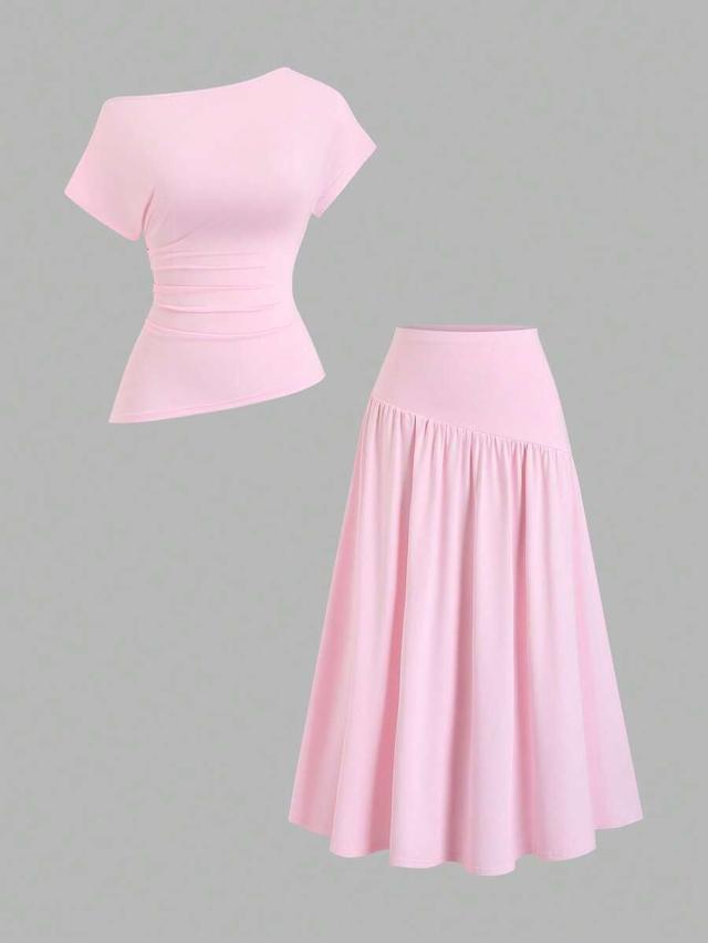 light pink asymmetric ruched top and pleated skirt set