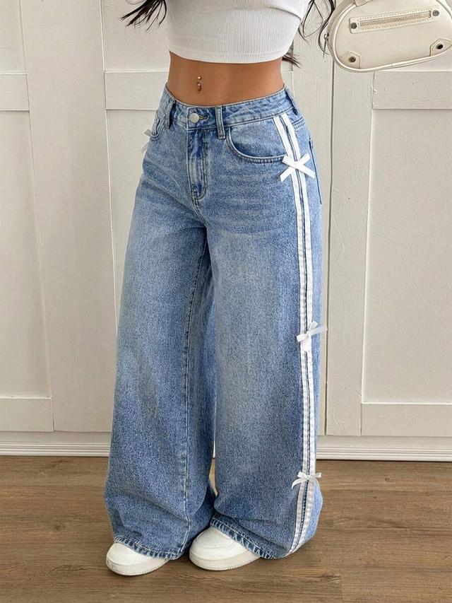 light wash denim jeans with side ribbon detailing
