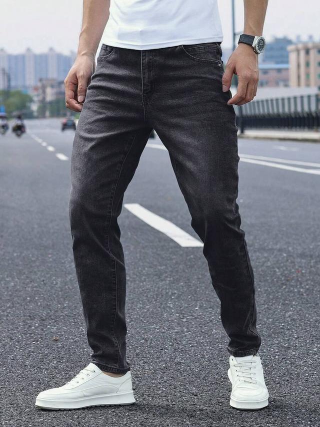 washed black tapered denim jeans