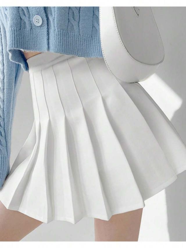 white pleated mini skirt