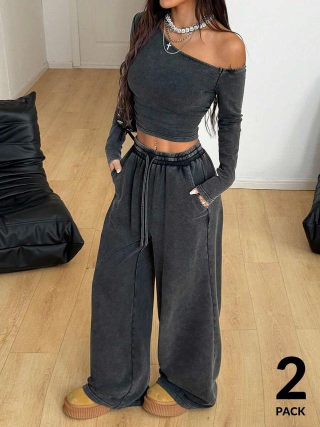grey asymmetrical neck long sleeve top and wide leg sweatpants
