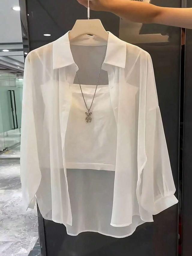 white transparent long sleeve collared button down shirt