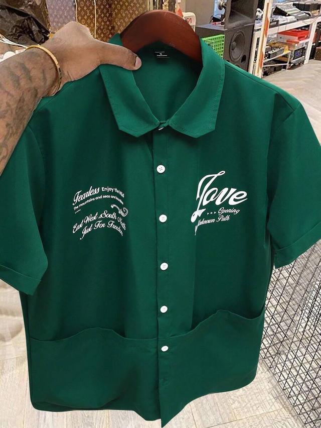 dark green short sleeve boxy shirt with graphic print
