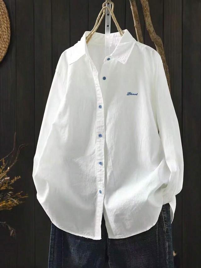 white cotton shirt with blue letter embroidery