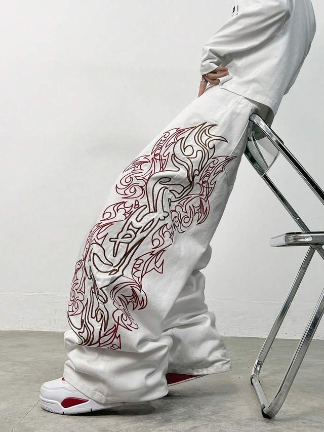 white denim wide leg jeans with red embroidery