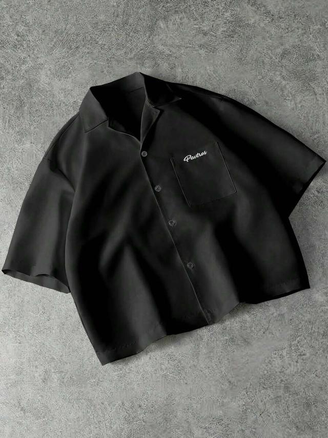 black short sleeve button-up shirt with chest pocket