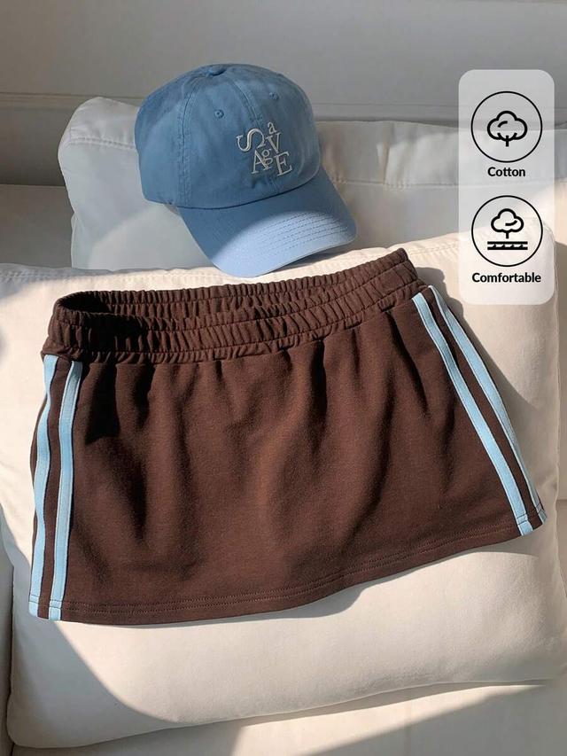 brown sporty mini skirt with blue side stripes