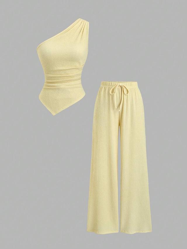 yellow pleated asymmetric hem top and pants set