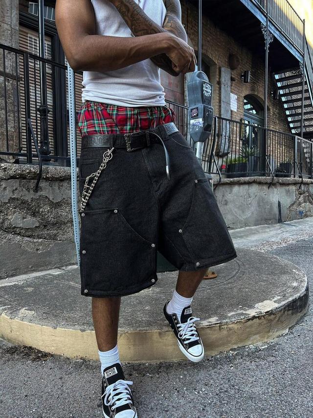 loose black denim bermuda shorts with rivet detailing