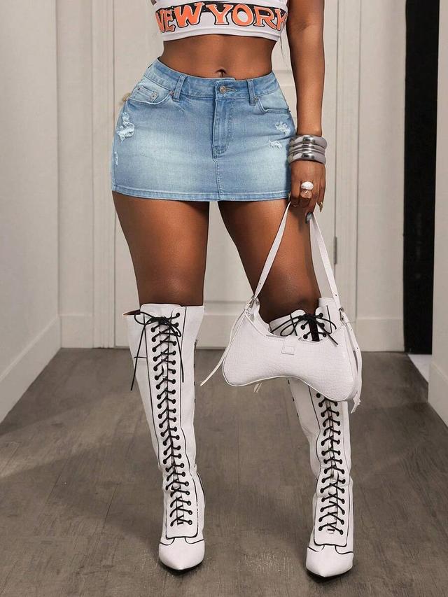 light wash distressed denim mini skirt