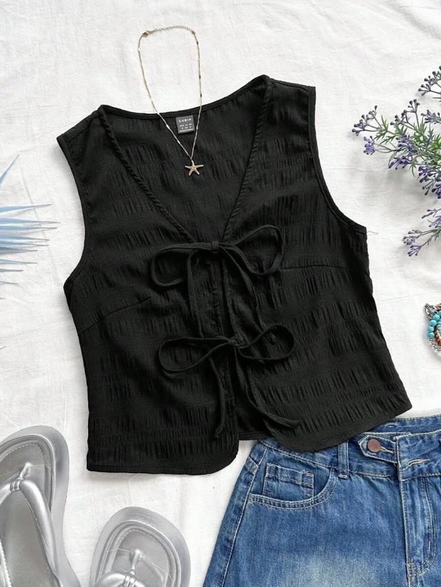 black sleeveless textured top with front bowknot ties