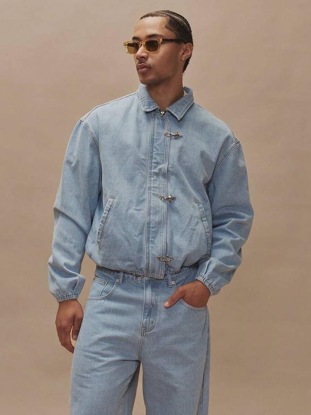 oversized light wash denim jacket with clasp hardware