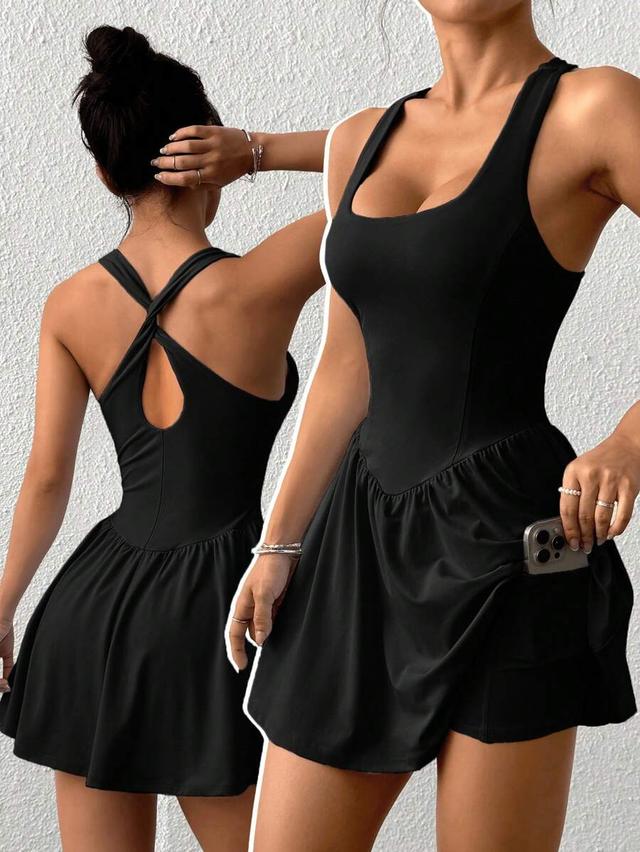 black corset-style mini dress with drop waist