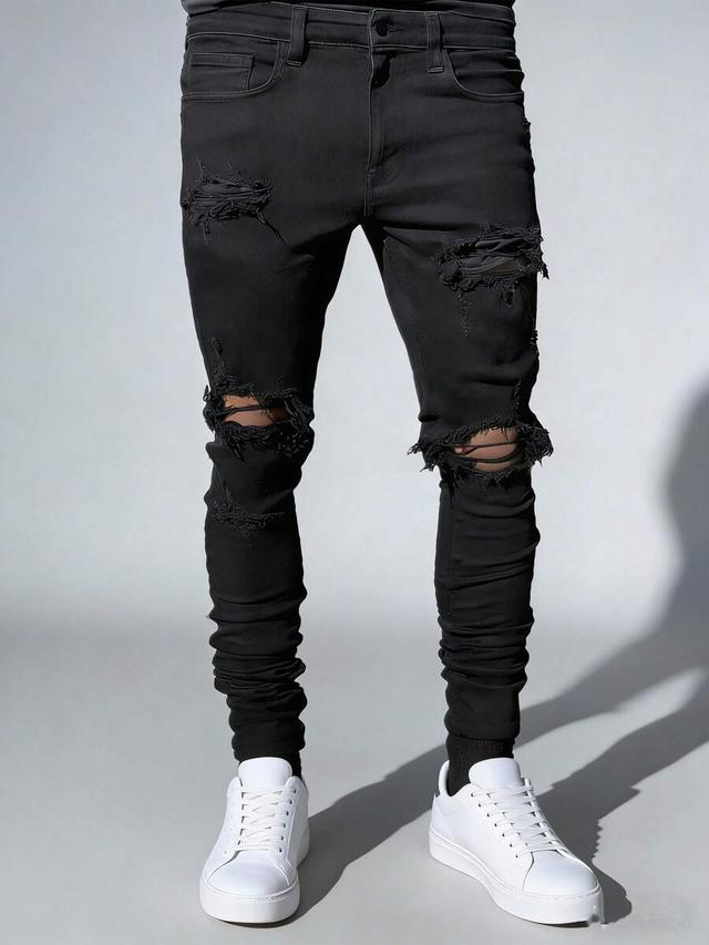 men's black skinny jeans with extreme rips and ruching