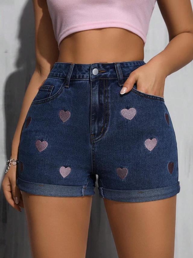 dark wash denim shorts with embroidered heart pattern