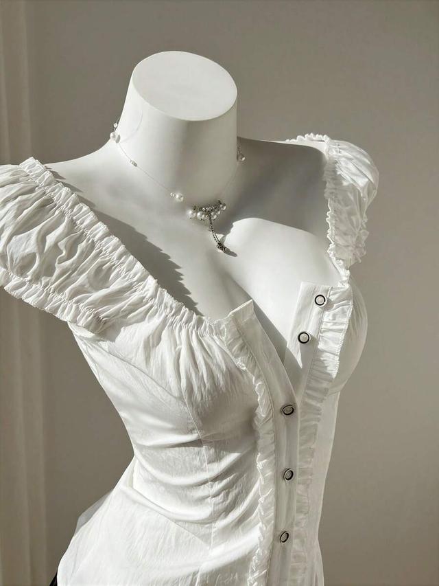 minimalist white ruffled corset blouse with puff sleeves