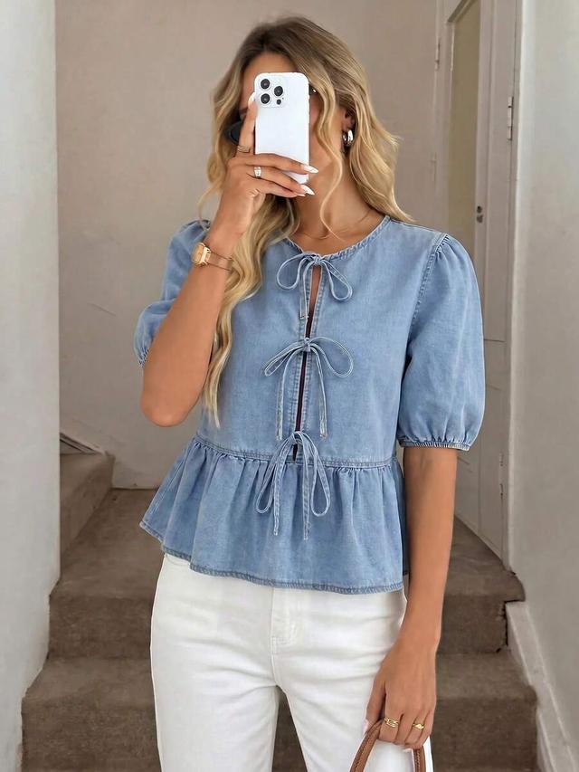 light wash denim peplum blouse with tie front