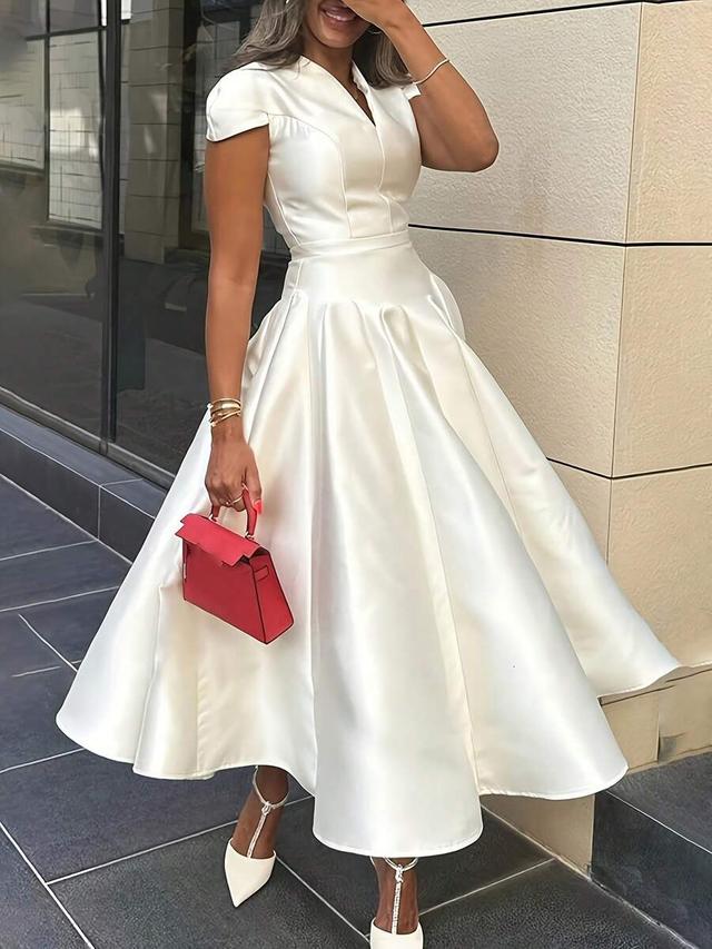 white satin midi dress with pleated skirt