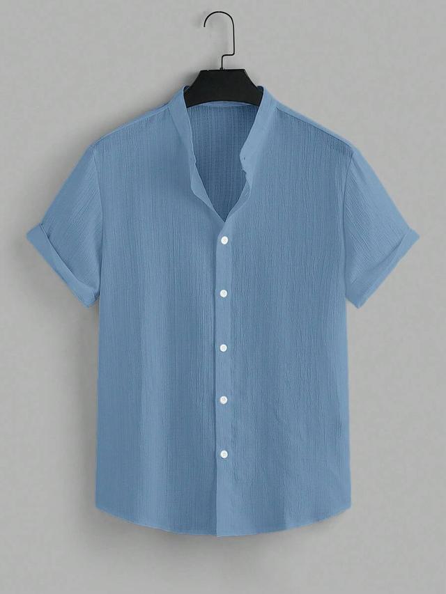 solid blue textured short sleeve button down shirt