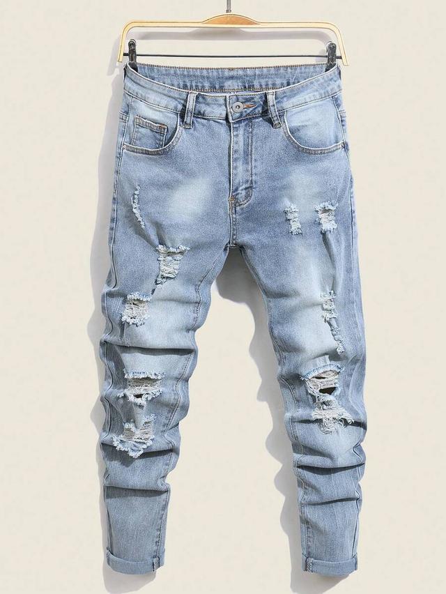 light wash distressed denim jeans